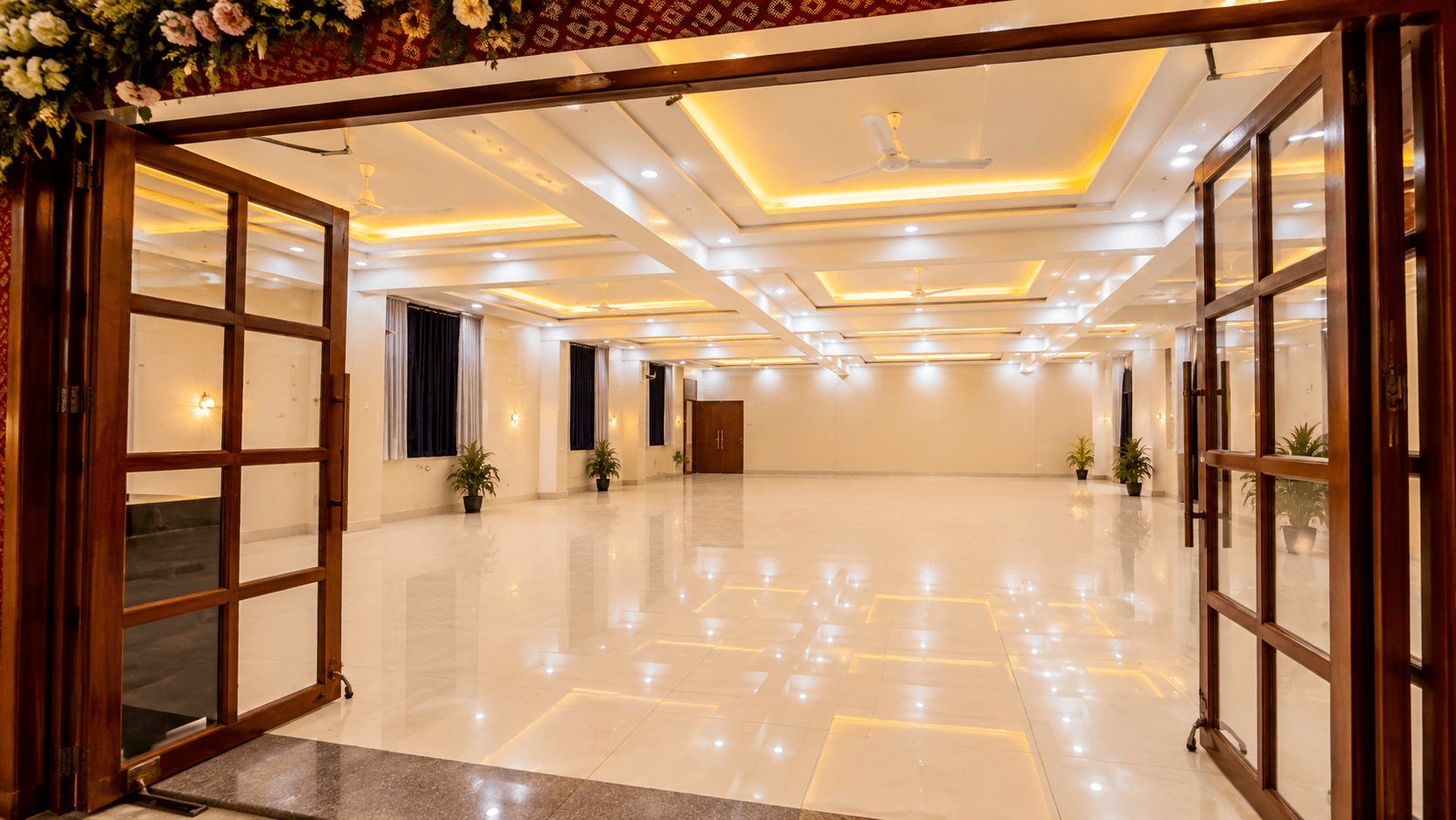 Banquet hall entrance decorated with florals at The City Crown Resort